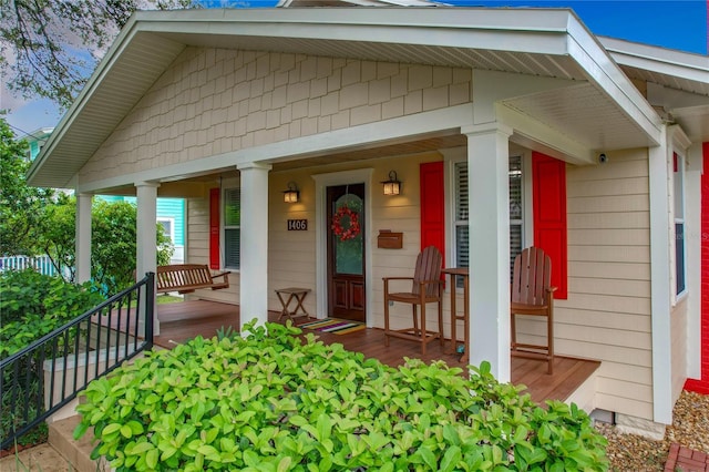 property entrance with covered porch