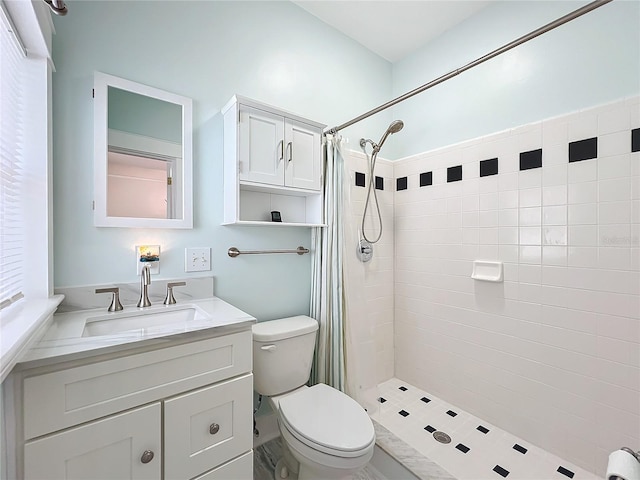 bathroom with a shower with curtain, vanity, and toilet