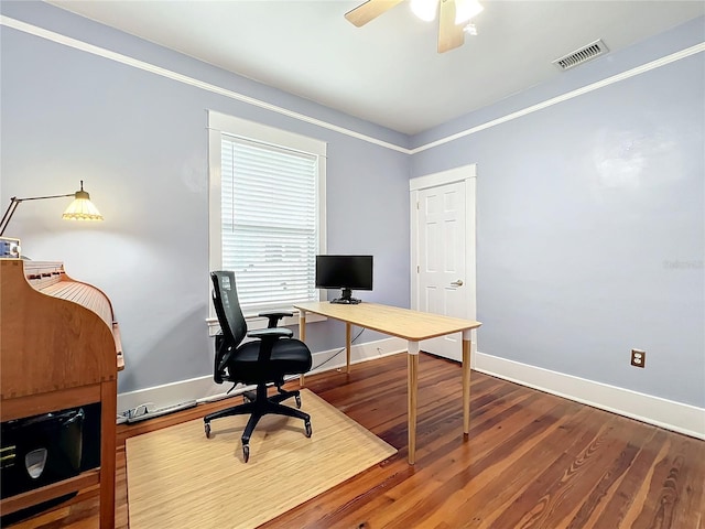 home office featuring ceiling fan, hardwood / wood-style floors, and ornamental molding