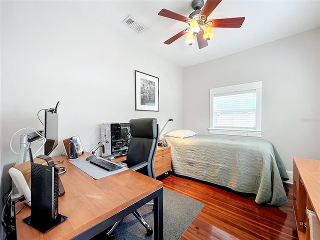 bedroom with wood-type flooring and ceiling fan