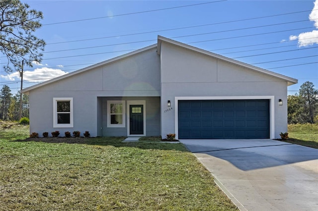 view of front facade featuring a front lawn and a garage