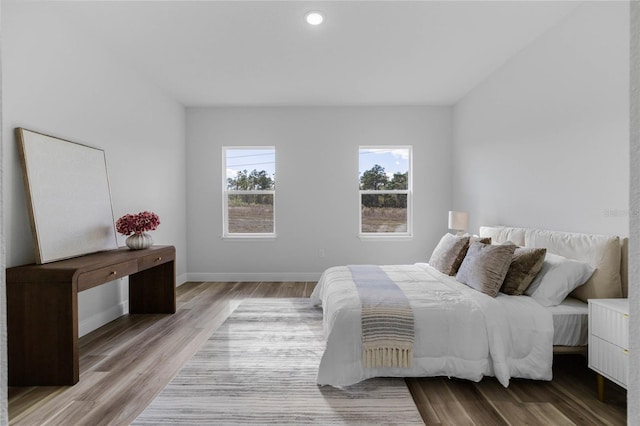 bedroom with light hardwood / wood-style flooring