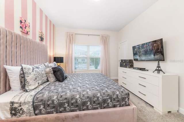 bedroom featuring light carpet