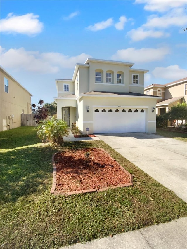 front of property with a front yard and a garage