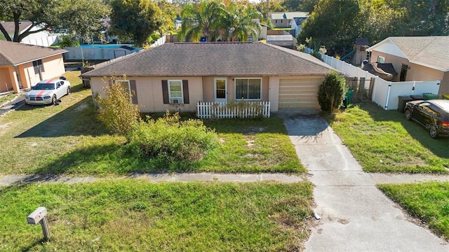 view of front facade with a front yard and a garage