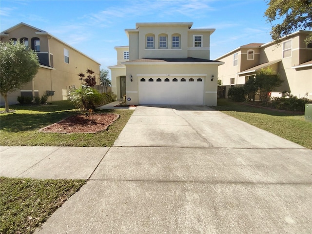 view of front of house featuring a garage and a front yard