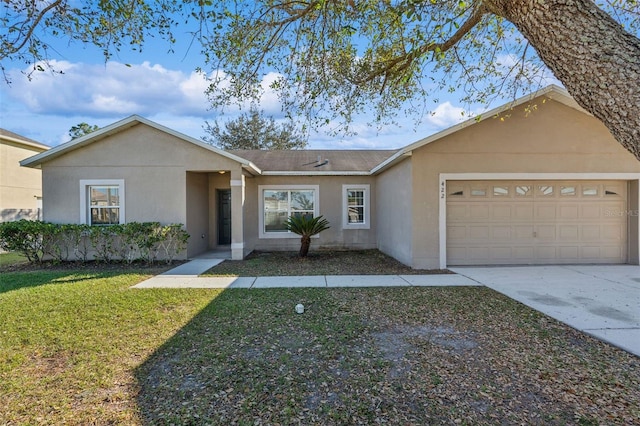 single story home with a front yard and a garage