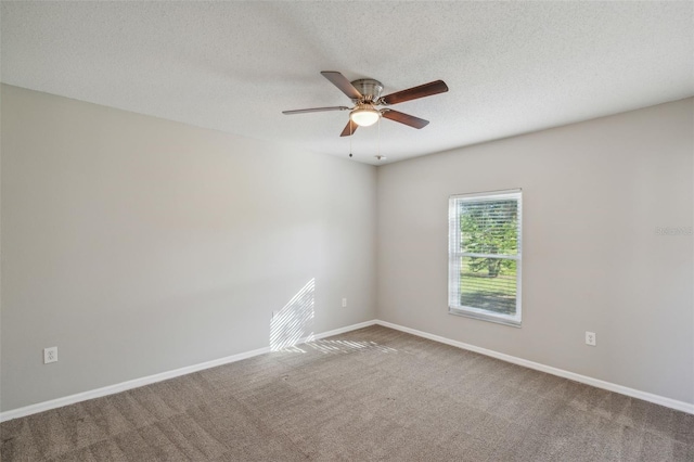 unfurnished room with ceiling fan, carpet floors, and a textured ceiling