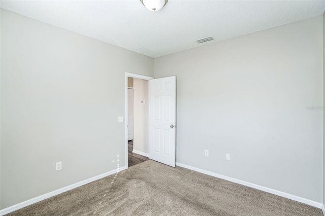 unfurnished room featuring carpet flooring