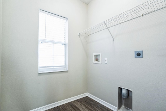 washroom featuring hookup for an electric dryer, dark wood-type flooring, a healthy amount of sunlight, and washer hookup