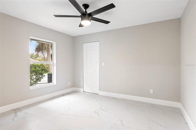 spare room with ceiling fan