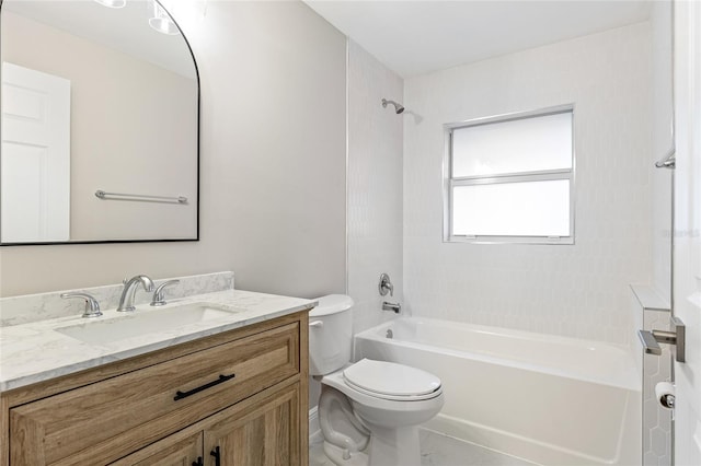 full bathroom with vanity, tiled shower / bath combo, and toilet