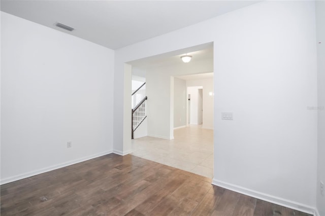 spare room featuring hardwood / wood-style flooring