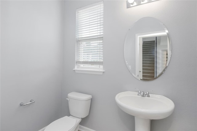 bathroom featuring toilet and sink