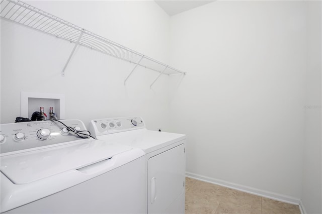 washroom featuring washing machine and dryer