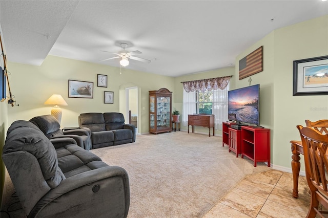 living room featuring ceiling fan and light carpet