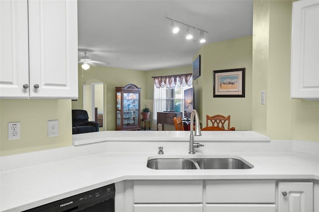 kitchen with sink, white cabinets, track lighting, and black dishwasher