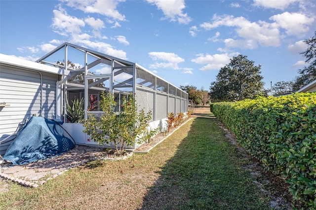 view of yard featuring a lanai