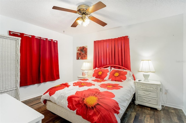 bedroom featuring a textured ceiling, ceiling fan, and dark hardwood / wood-style floors