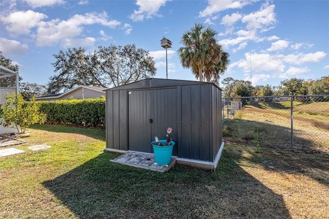 view of outbuilding featuring a yard