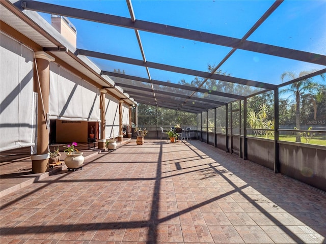 view of patio with glass enclosure