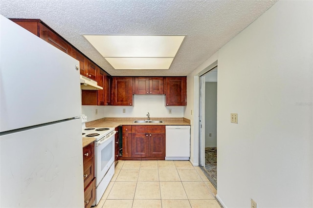 kitchen featuring a textured ceiling, sink, light tile patterned floors, and white appliances