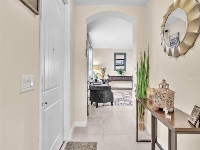 hallway with light tile patterned floors