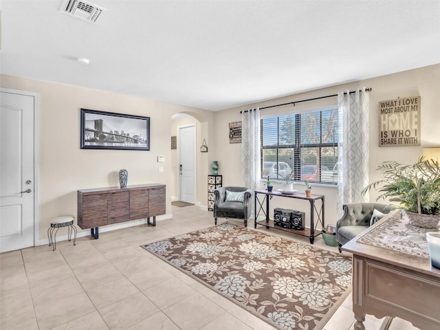 living area featuring light tile patterned floors