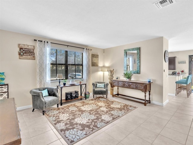 sitting room with light tile patterned floors