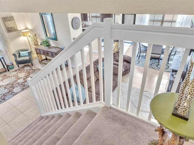 stairs featuring tile patterned flooring