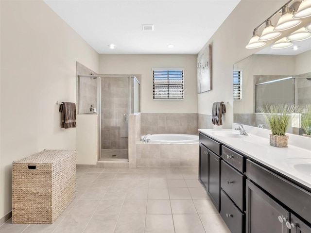 bathroom with tile patterned floors, separate shower and tub, and vanity