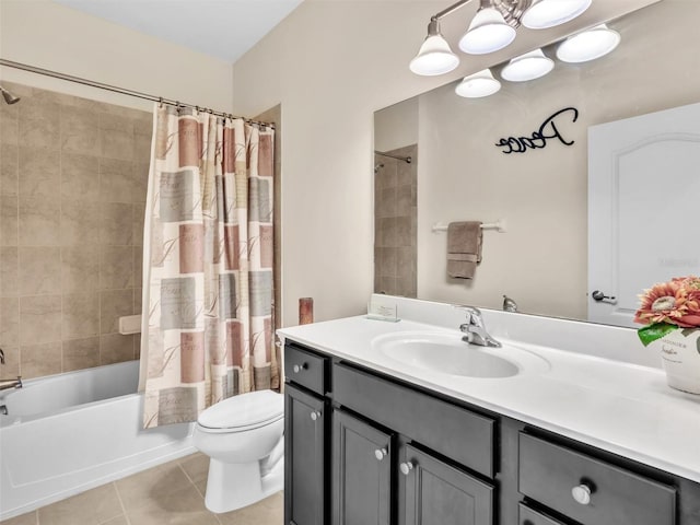 full bathroom with tile patterned floors, shower / bath combo with shower curtain, vanity, and toilet