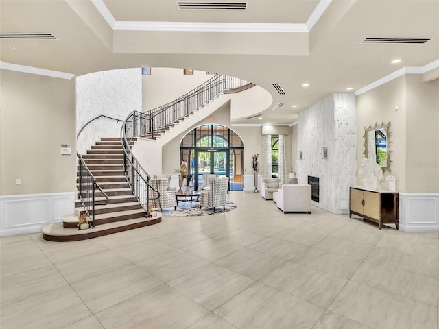 interior space with a fireplace and crown molding