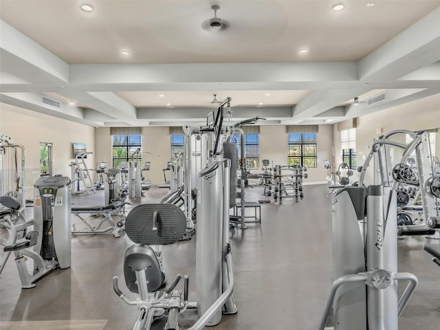 gym with a raised ceiling