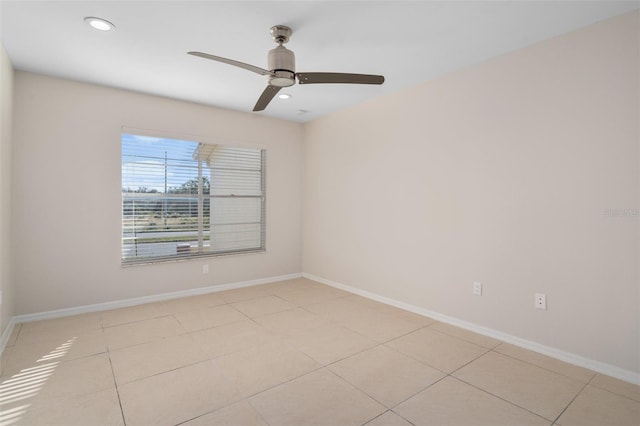 tiled empty room with ceiling fan