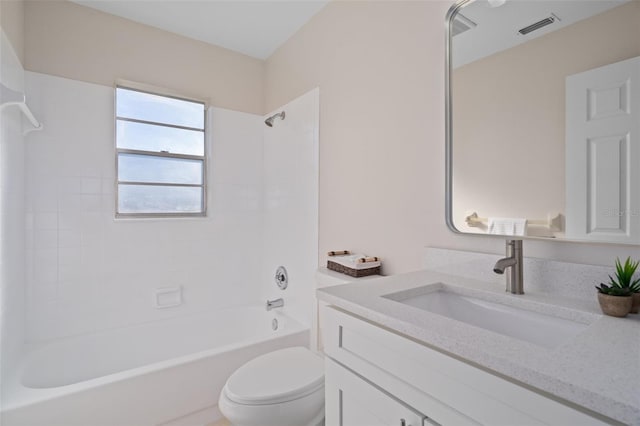 full bathroom featuring vanity, toilet, and tiled shower / bath combo