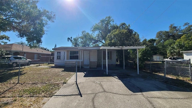 view of front of property featuring a carport