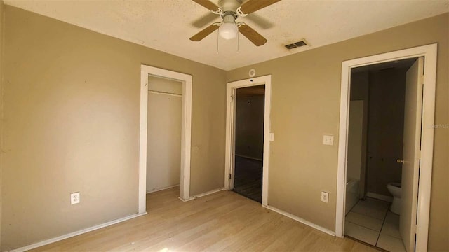 unfurnished bedroom with light hardwood / wood-style flooring and ceiling fan