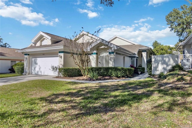 view of front of home with a garage and a front yard