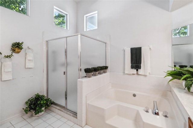 bathroom featuring tile patterned floors and plus walk in shower