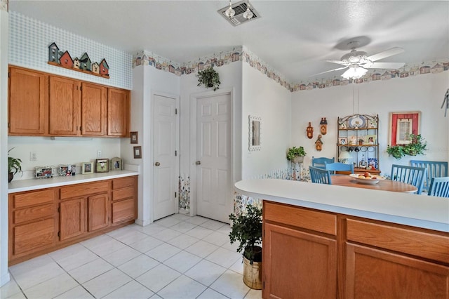 kitchen featuring ceiling fan and light tile patterned floors