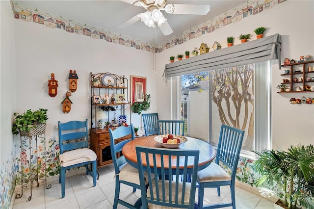 tiled dining room with ceiling fan