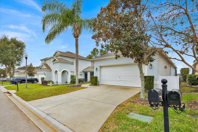 view of front of house with a garage and a front yard