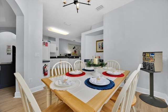 dining area with light wood-type flooring