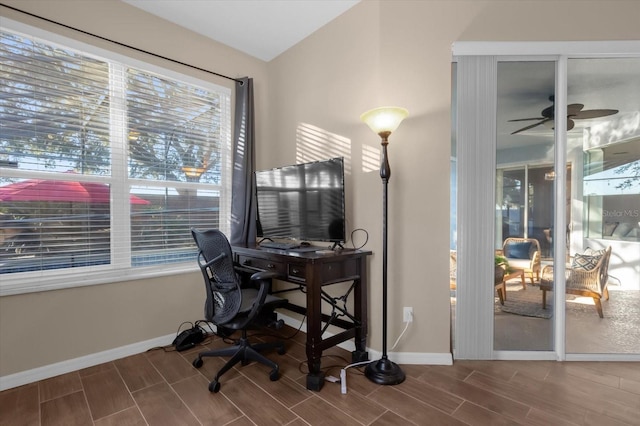 home office with hardwood / wood-style flooring and ceiling fan