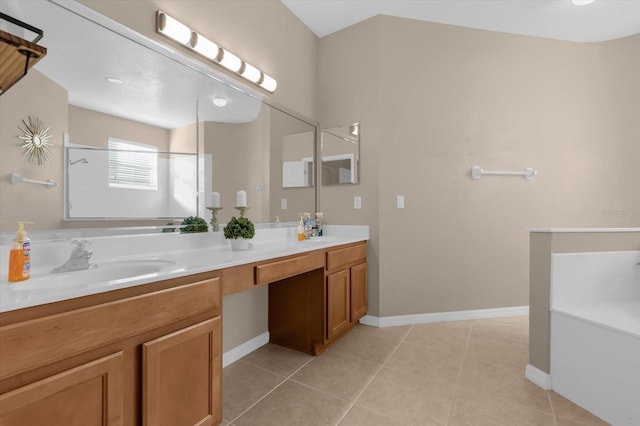 bathroom with tile patterned floors and vanity