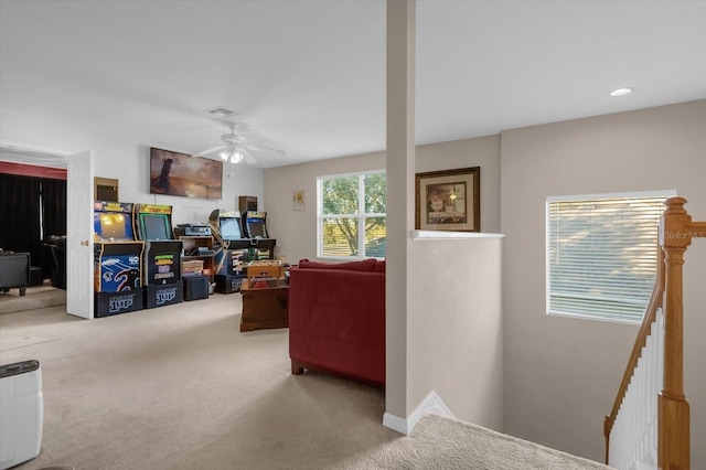 interior space featuring carpet flooring and ceiling fan