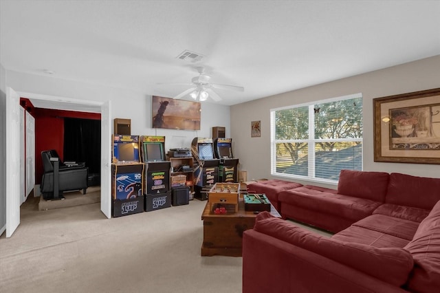 carpeted living room featuring ceiling fan