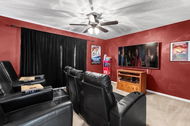 home theater featuring a textured ceiling, light colored carpet, and ceiling fan