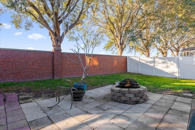 view of patio / terrace with a fire pit